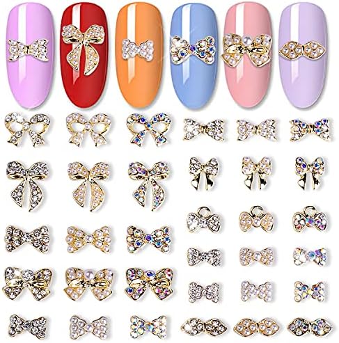 JERCLITY 33 komada srebrne legure Privjesci Za mašne za nokte luk Privjesci za nokte Gems Bowknot Čavli za nokte umetnuti Pearl Clear Iridescent Rhinestone za žene djevojke Nail Art